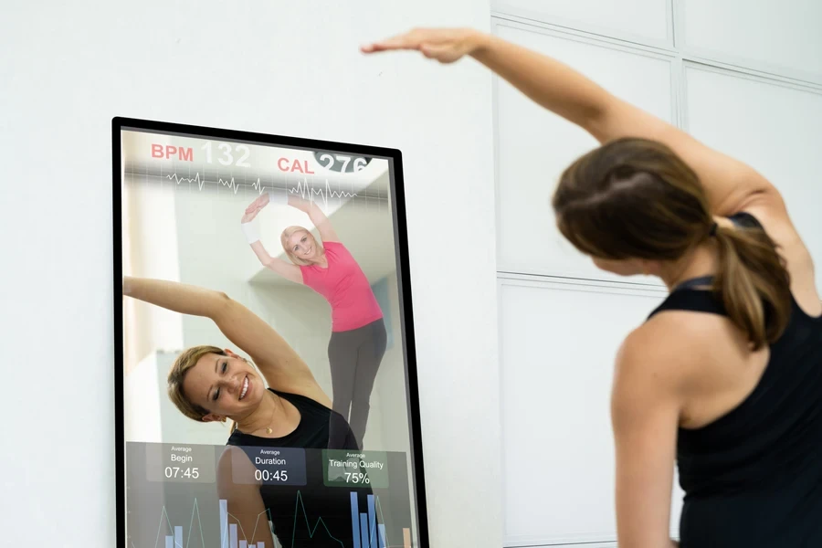 Woman using a digital mirror for her workout