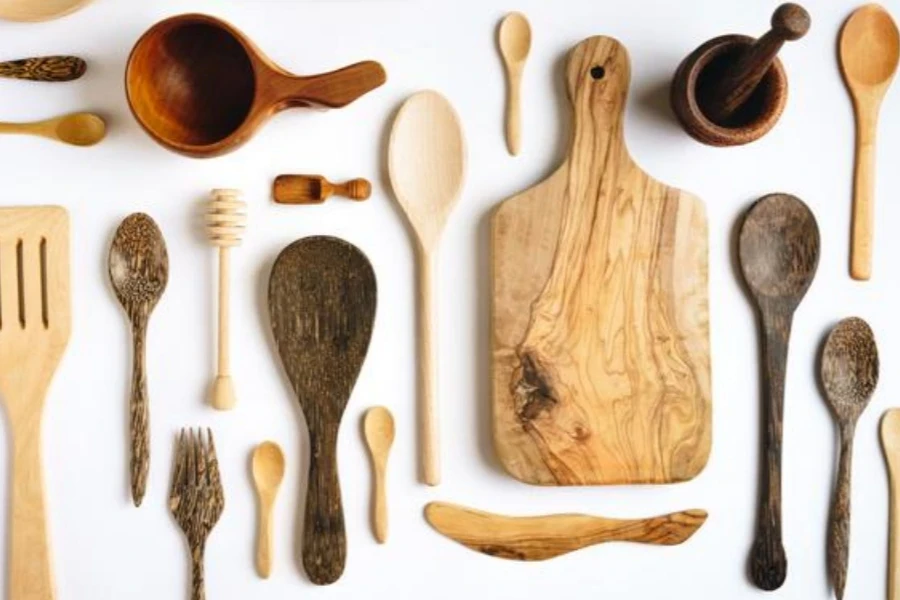 Wooden kitchen utensils on white background