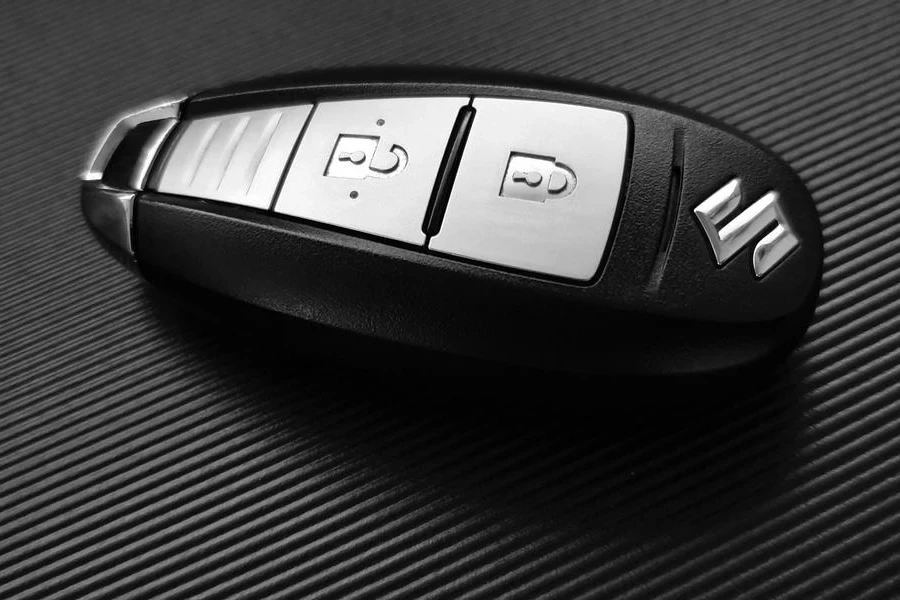A black and grey Suzuki key fob