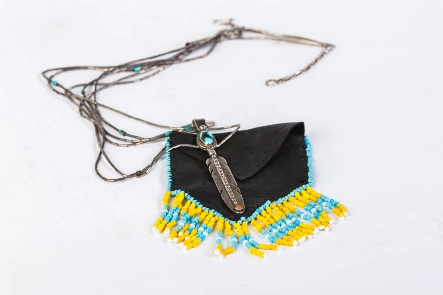 A black bag with beaded tassels