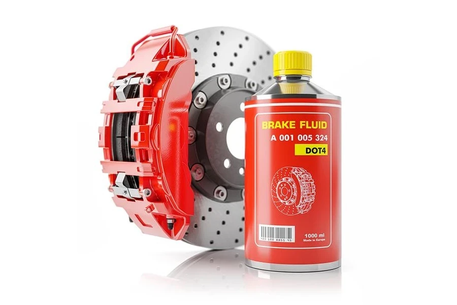A can of brake fluid next to a brake disk and car caliper