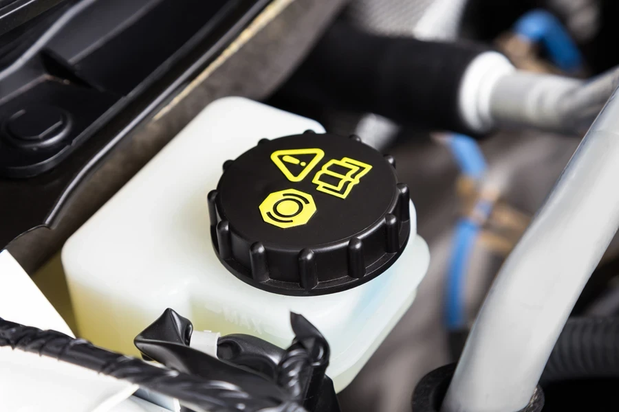 A close-up photo of a brake fluid reservoir