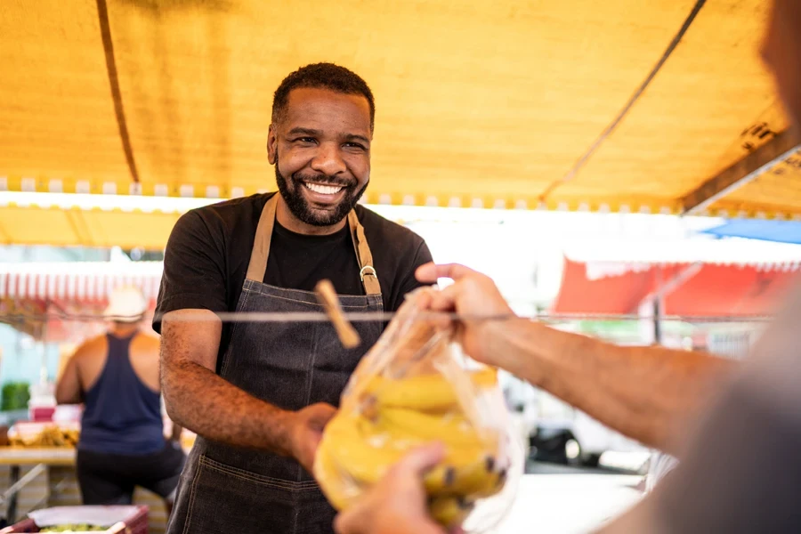 A local business owner selling bananas