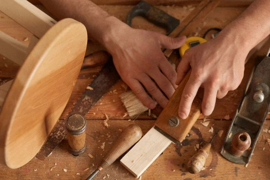 A person working with wood cutting tools