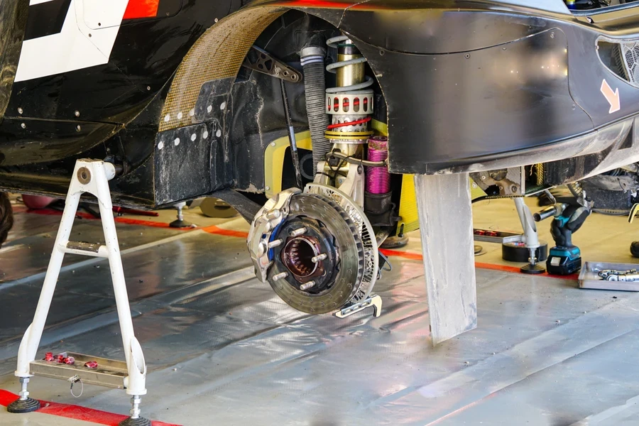 A rally car showing the suspension and brake disc