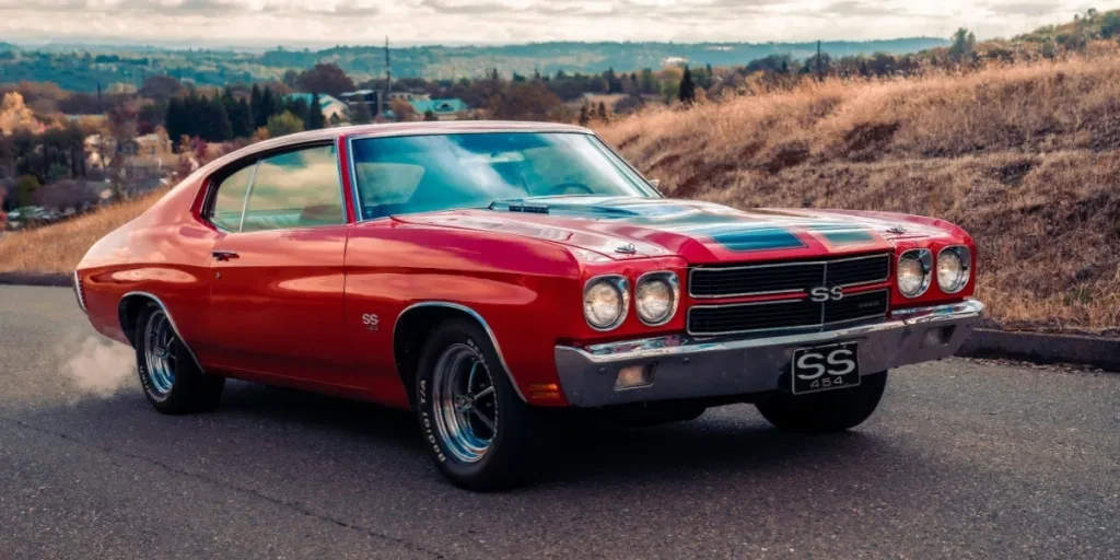 A red muscle car on the road