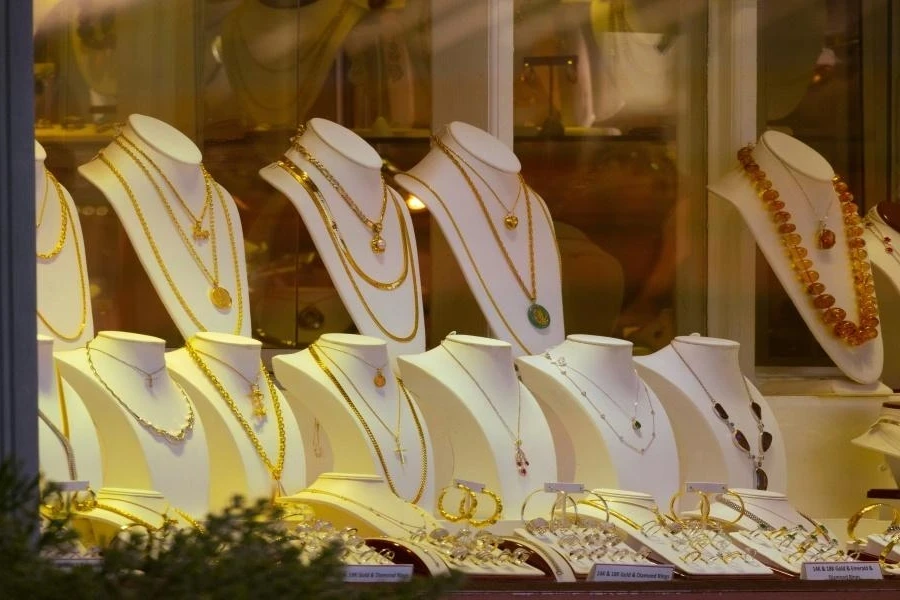A row of mannequins with assorted jewelry