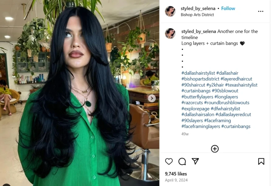 A screenshot of a  woman rocking curtain bangs