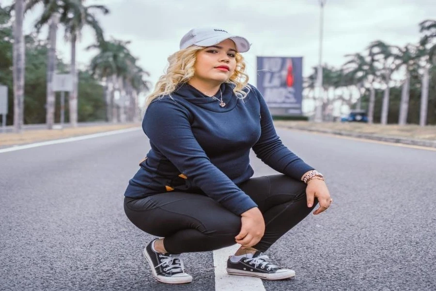 A woman in comfortable athleisure squatting