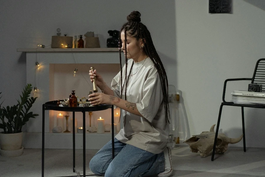 A woman lighting a candle