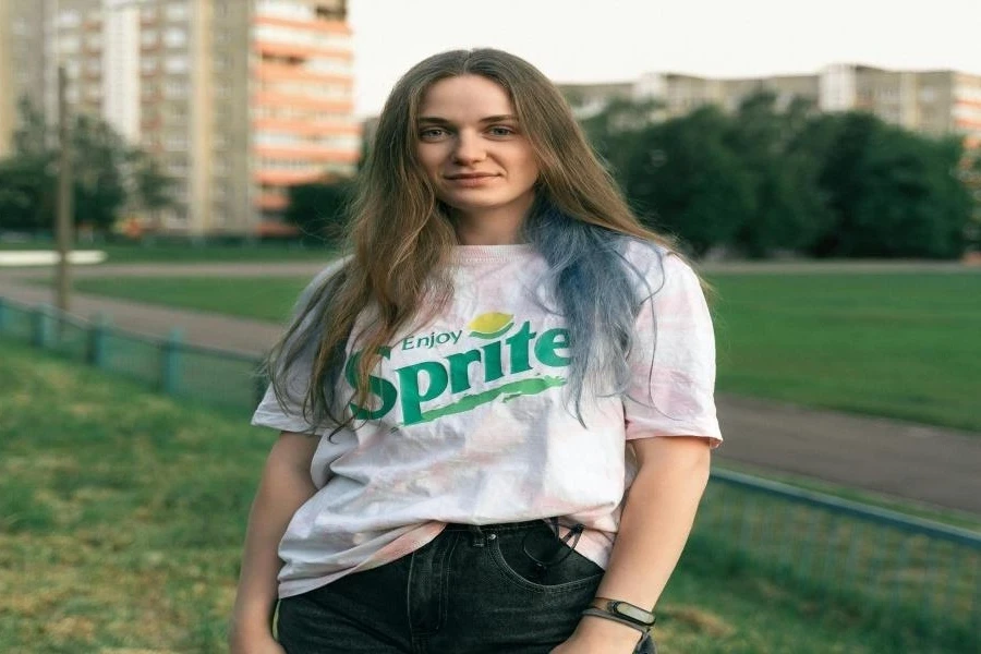 A woman wearing a baggy white t-shirt