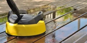 A yellow cordless electric spin scrubber