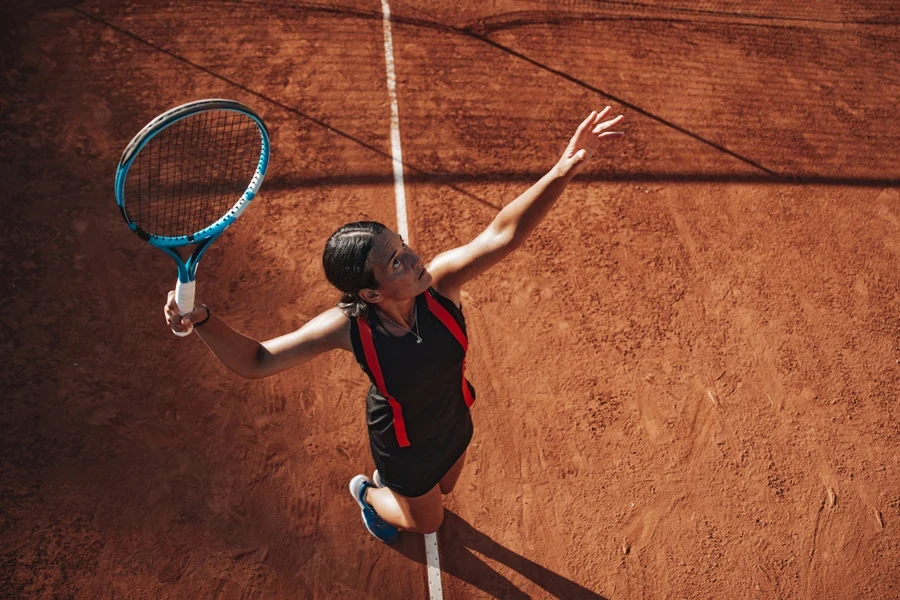 Aerial view of woman hitting serve during game
