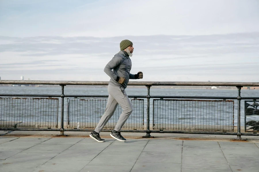 An Elderly Man Running Beside the Beach
