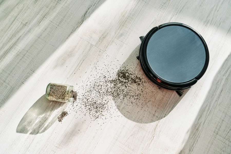 An auto-empty cordless vacuum cleaning a spill