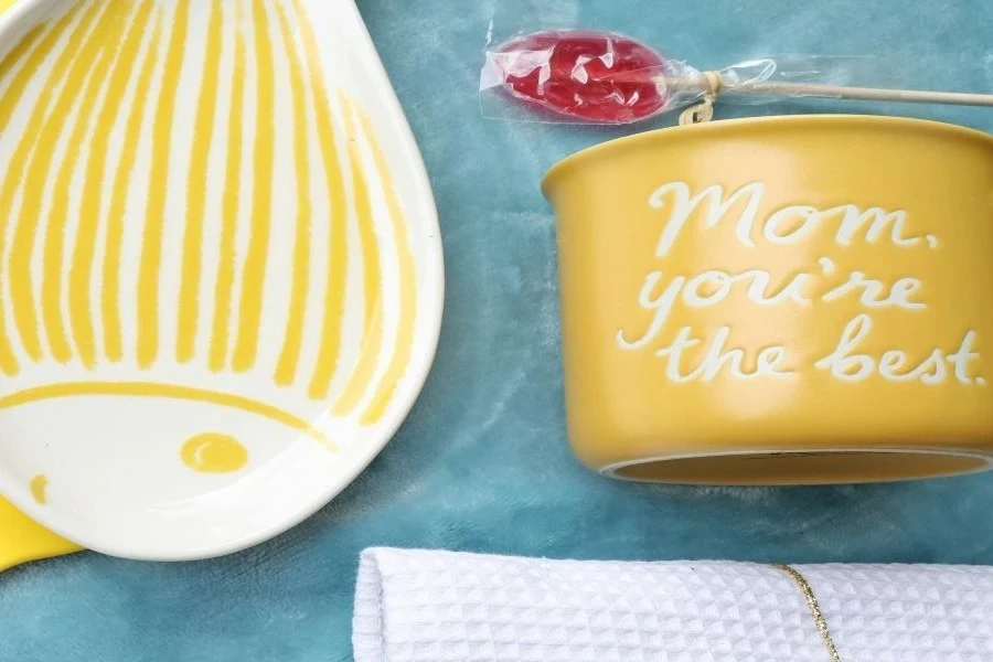 An engraved yellow mug and plate on a table