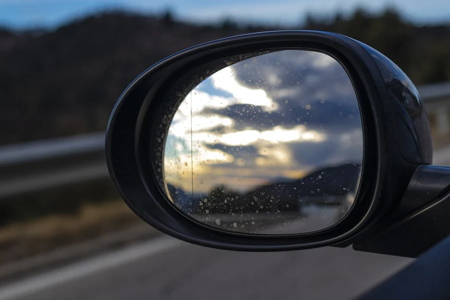 Aspherical mirror attached to the side of a car