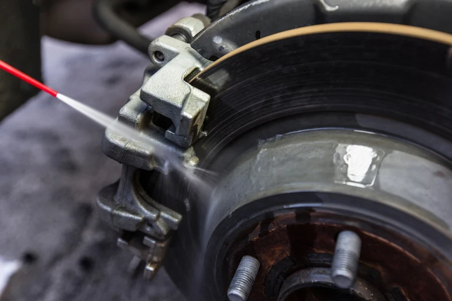 Cleaning a car brake pad and disk with caliper
