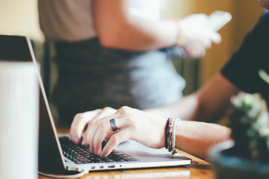 Close up of person typing on laptop