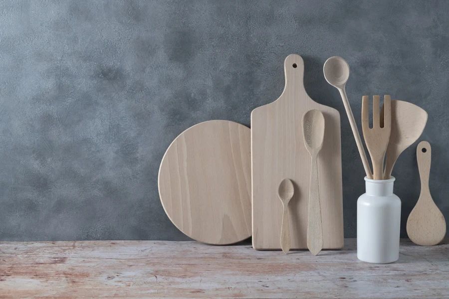 Different wooden kitchenware arranged neatly
