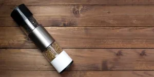 Electric pepper mill with two flavors of pepper