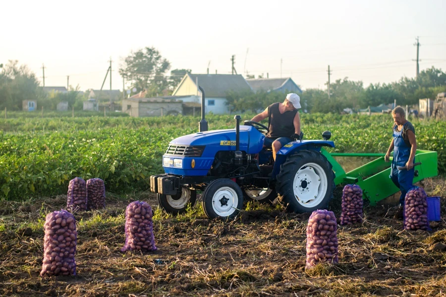 Farmer planting seeds with a tractor
