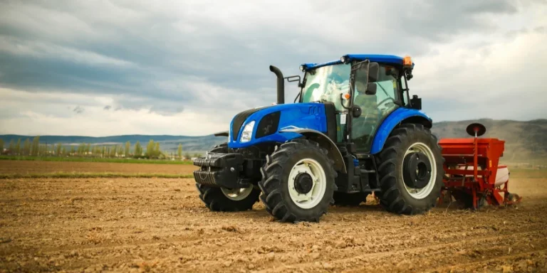 Farmer planting seeds with a tractor
