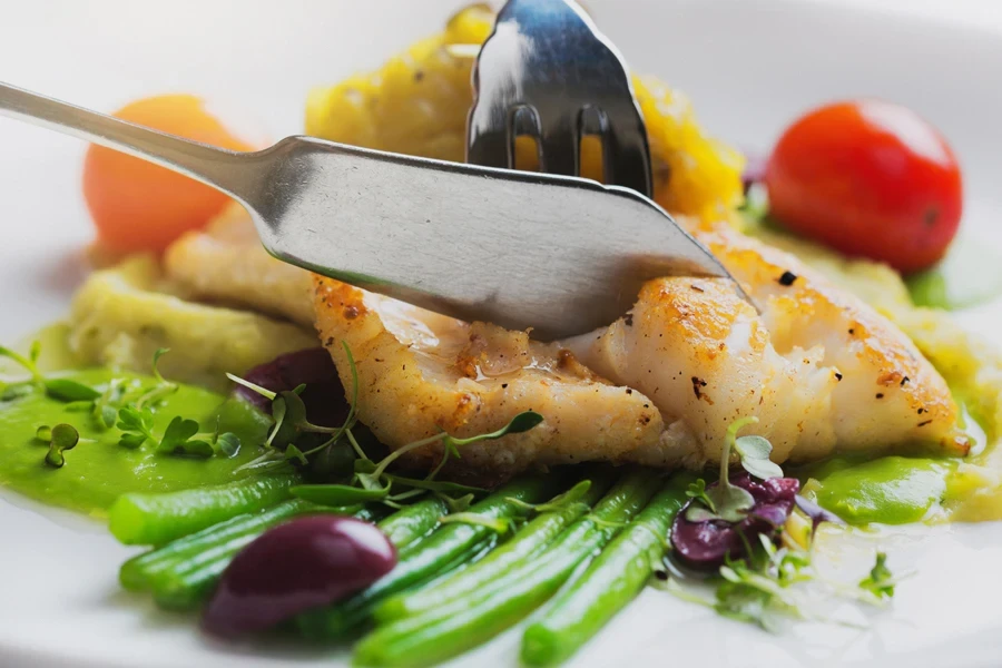 Fish knife used for dining, cutting through cooked fillet