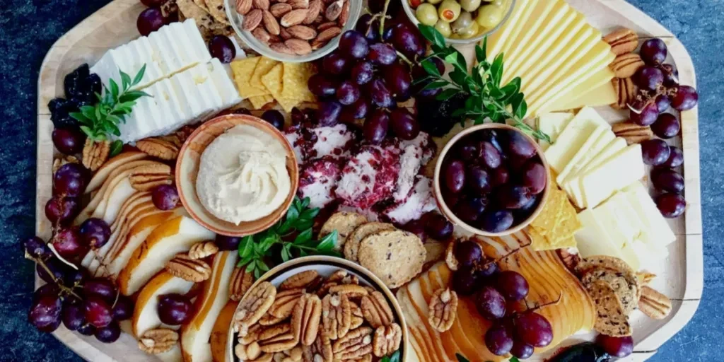 Grazing platter in autumn served on wooden shallow board