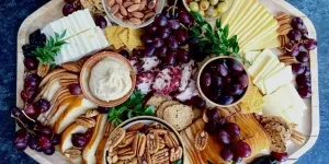 Grazing platter in autumn served on wooden shallow board