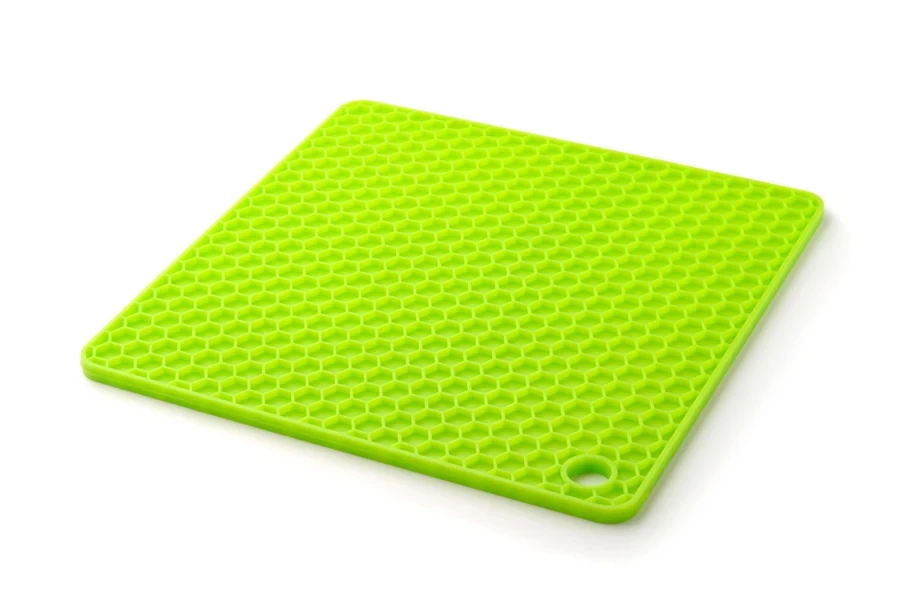 Green silicone trivet on a white background