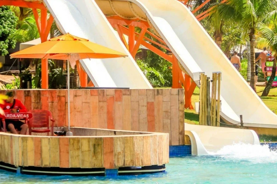 In-ground swimming pool slides in an exotic resort