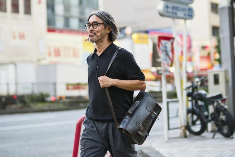 Japanese Man Walking on the Streets of the Shinjuku Ward in Tokyo, Japan