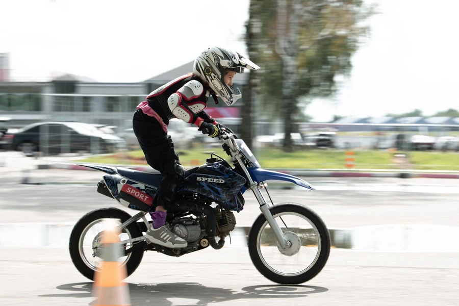 Little girl riding a motocross bike