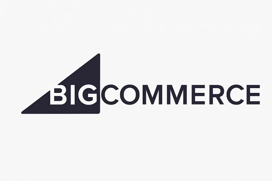 Logo of BigCommerce featuring a dark navy triangle