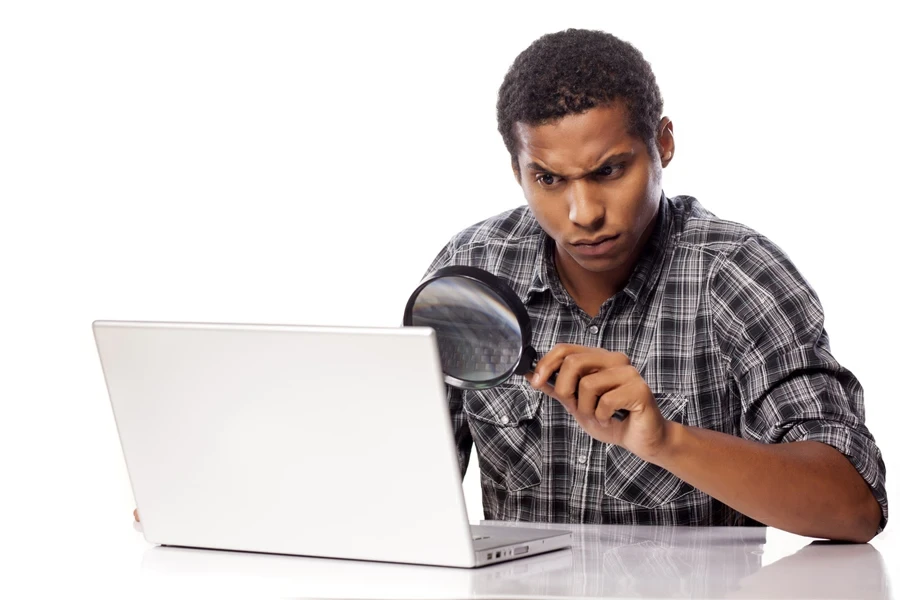 Man carefully checking something on laptop