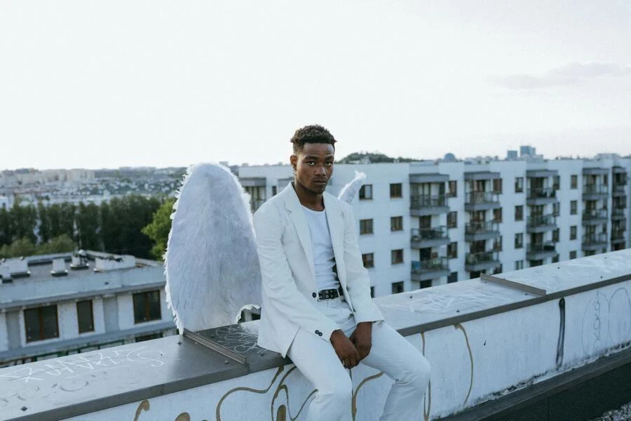 Man wearing an all-white angel costume