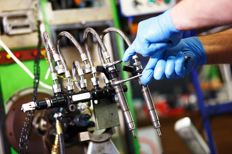Mechanic testing diesel fuel injectors
