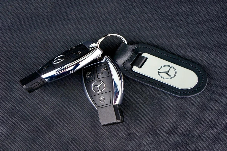 Mercedes-Benz key fobs on a black surface