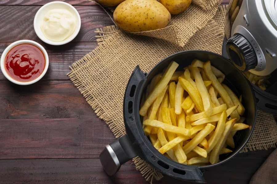 Multiple French fries cooked in an air fryer