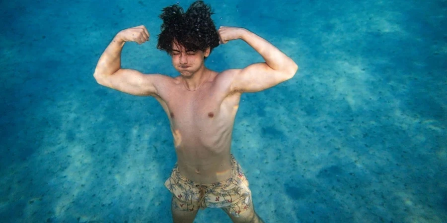 Muscle young man in the sea