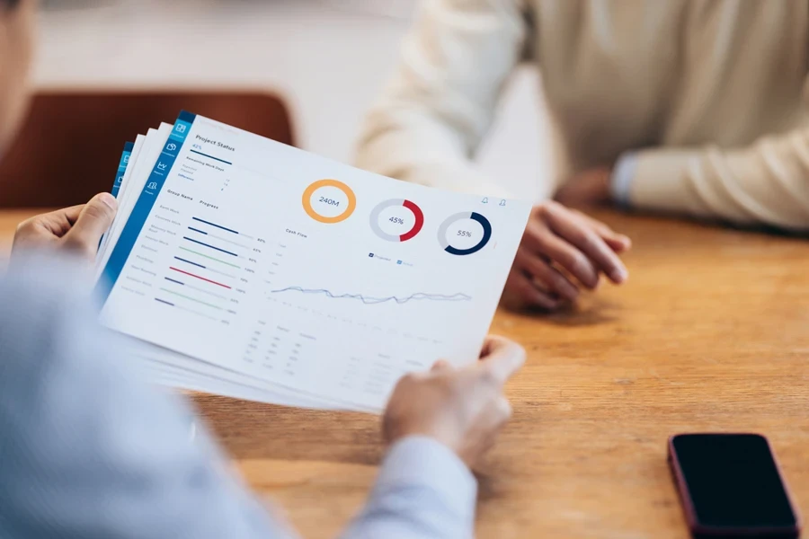 People analyzing the numbers on a financial report
