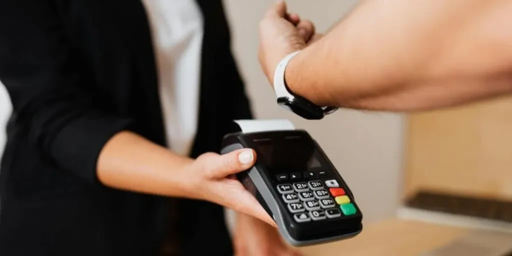 Person Paying Using Smartwatch
