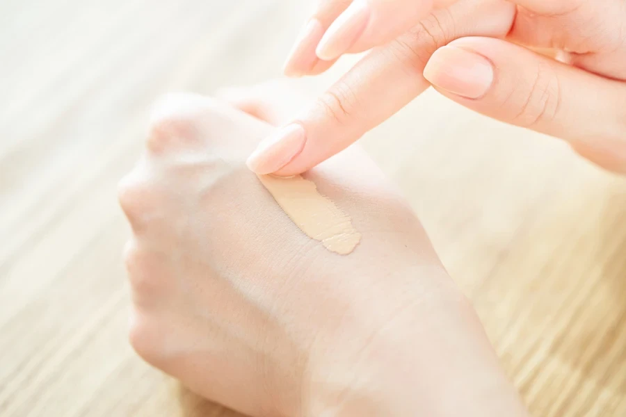 Person checking the color of skin tint