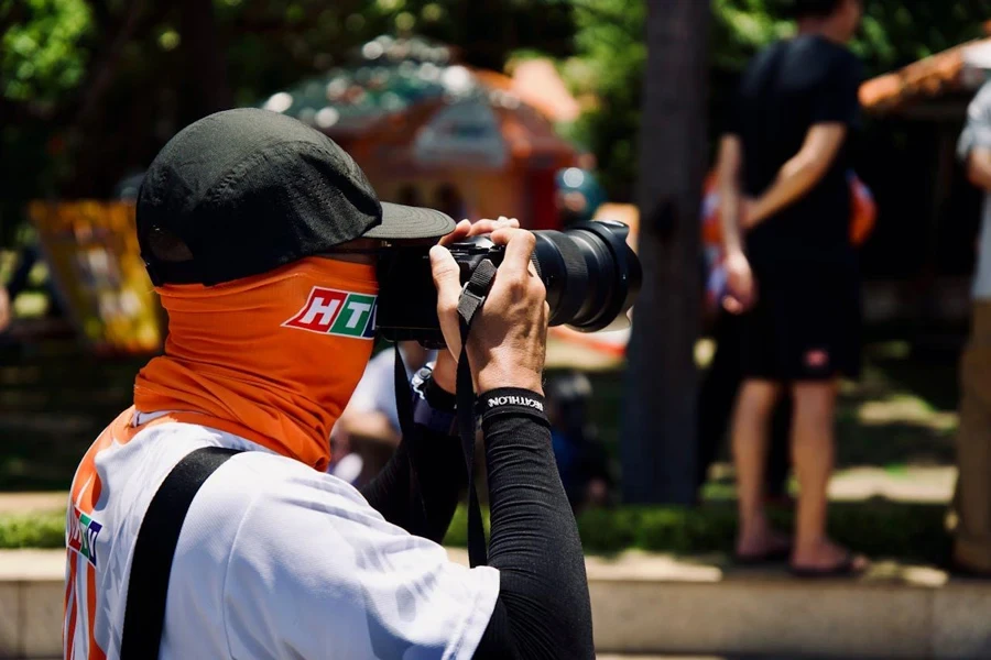 Person taking pictures at a sporting event