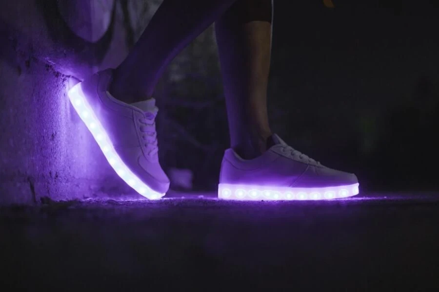 Person wearing white shoes with lights