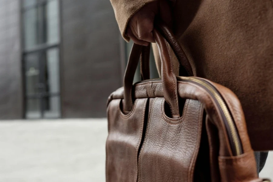 Photo of a Person's Hand Holding a Handbag
