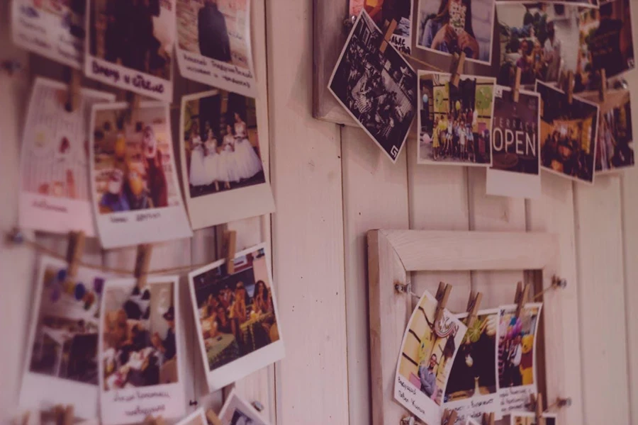 Polaroid pictures hung up on a wall