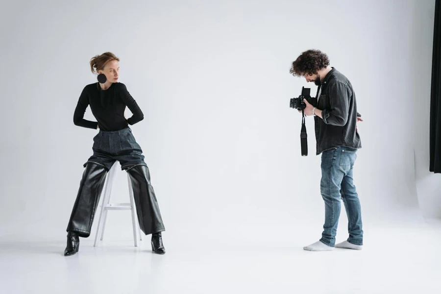 Professional photographer taking photo of a model