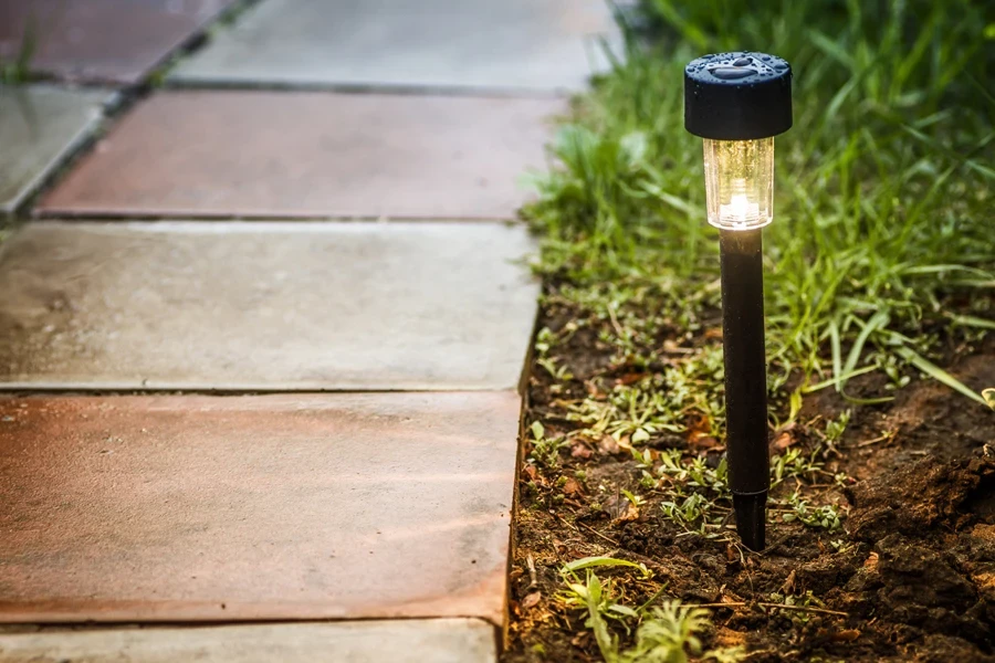 Solar-powered pathway light in a garden